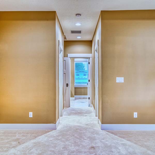 Hallway in Classic Ranch by Mike Riddle Construction