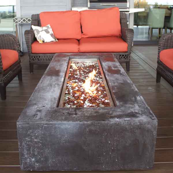 Patio Fire Feature in Modern Farmhouse by Mike Riddle Construction