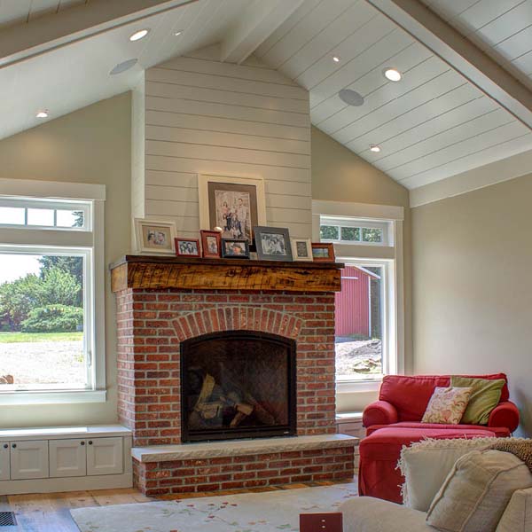 Fireplace in Contemporary Farmhouse by Mike Riddle Construction