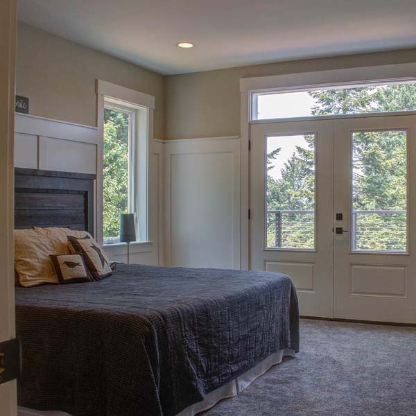 Bedroom in Contemporary Farmhouse by Mike Riddle Construction
