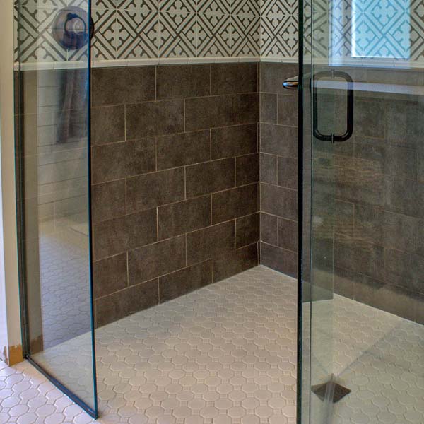 Shower in Contemporary Farmhouse by Mike Riddle Construction