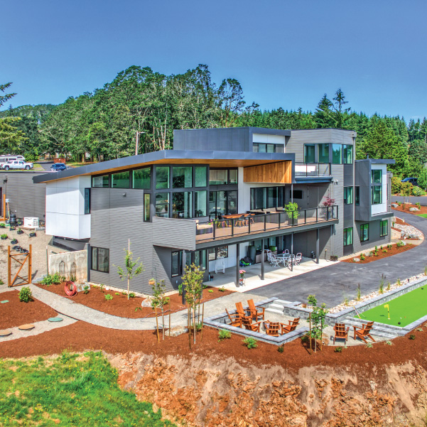 Aerial view of an industrial modern home built by Mike Riddle Construction