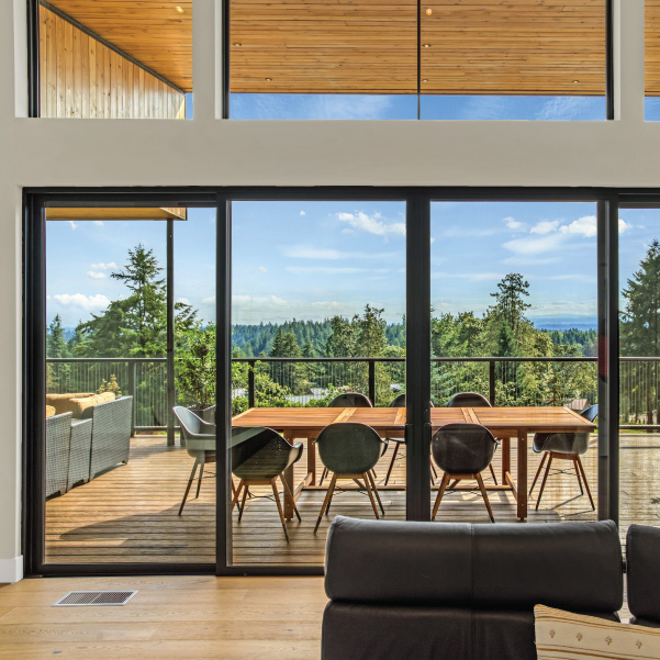 View through the large sliding doors of a custom home built by Mike Riddle Construction