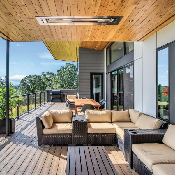 An outdoor deck of a modern home featuring industrial design built by Mike Riddle Construction