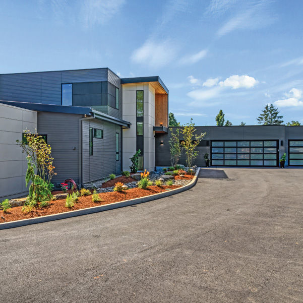 Driveway entrance of an industrial modern home built by Mike Riddle Construction