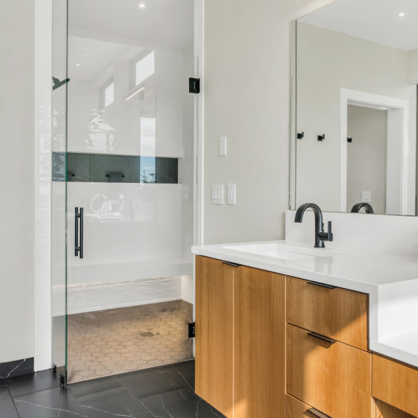 White walk-in shower with bathroom sink