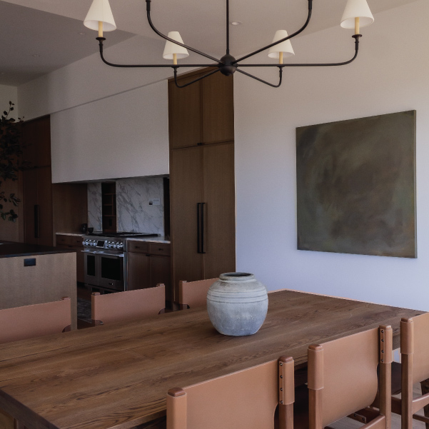 Tranquil dining table next to the open kitchen of the Lagom built by Mike Riddle Construction