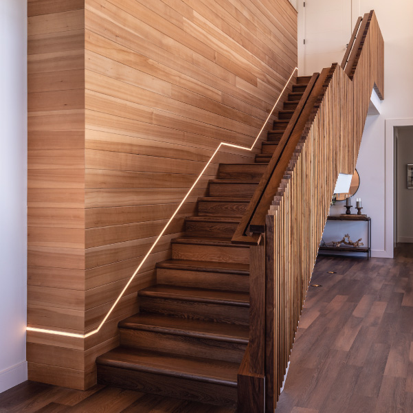 Wood staircase in an Oregon coast home built by Mike Riddle Construction