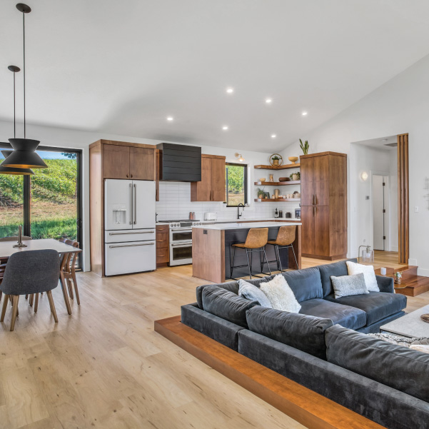 View over sunken living area into kitchen of a wine country home built by Mike Riddle Construction