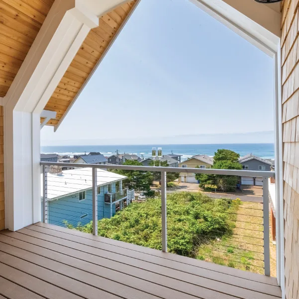 Ocean view from a cottage deck with an arch frame