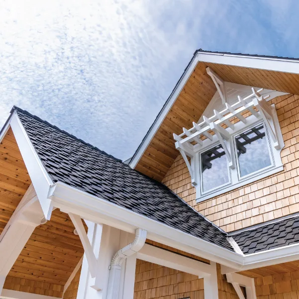 Looking up at a second floor window of a coastal cottage